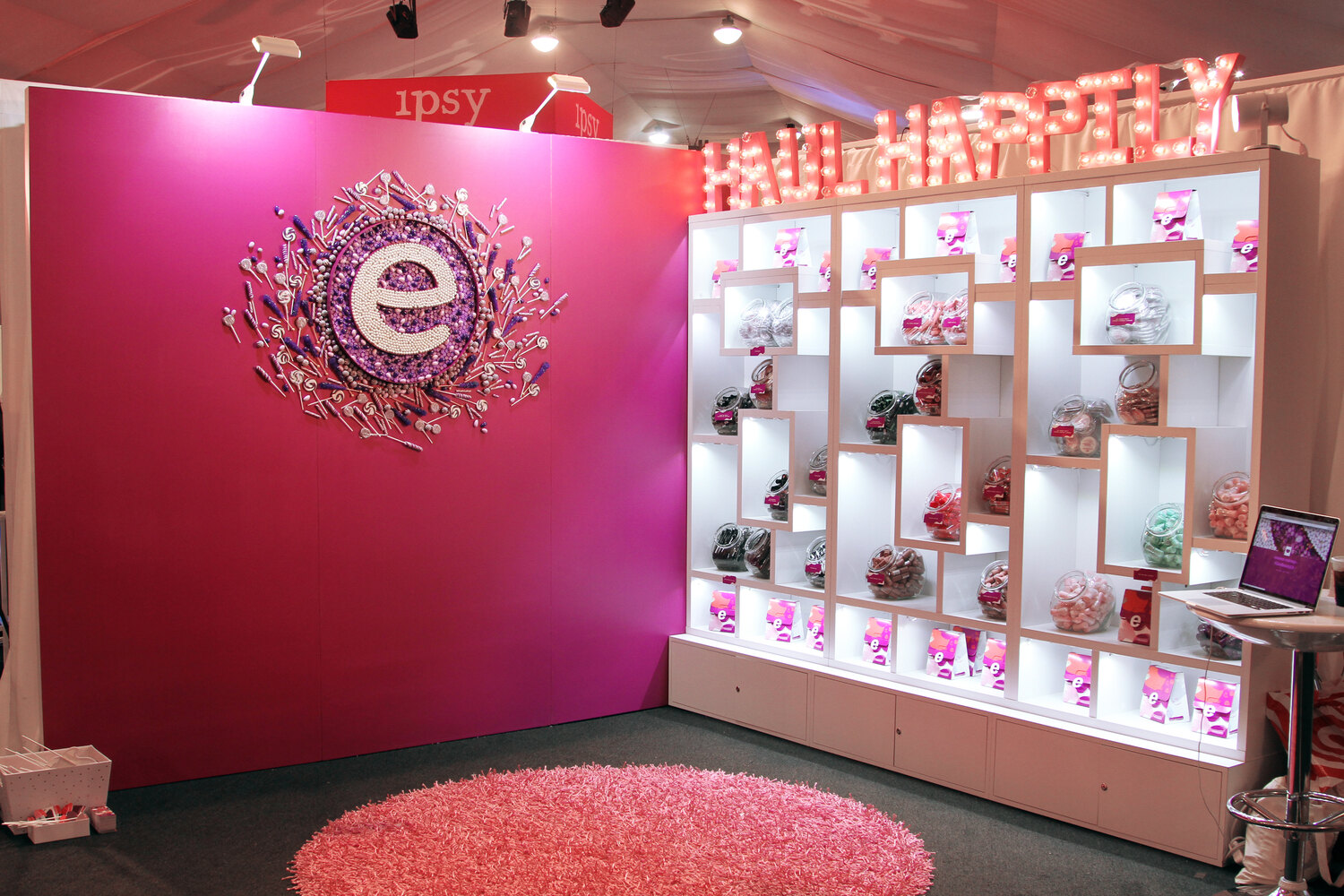 Custom retail exhibit with illuminated product wall