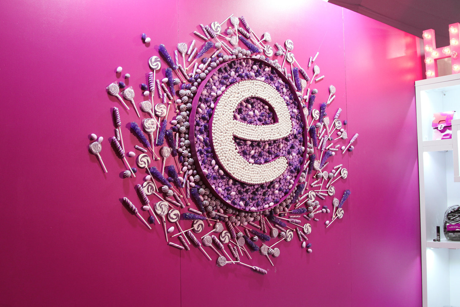 Custom candy-letter feature wall on an exhibit